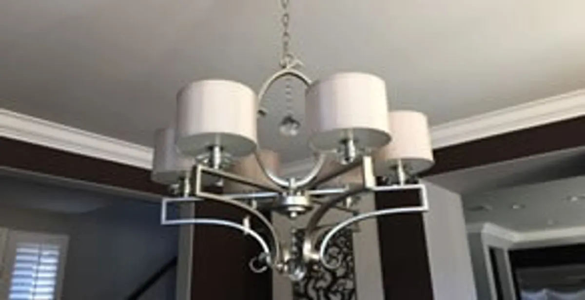 Modern chandelier installation with multiple light fixtures in Seattle, WA